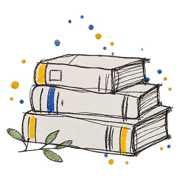 Stack of books topped with a green botanical sprig